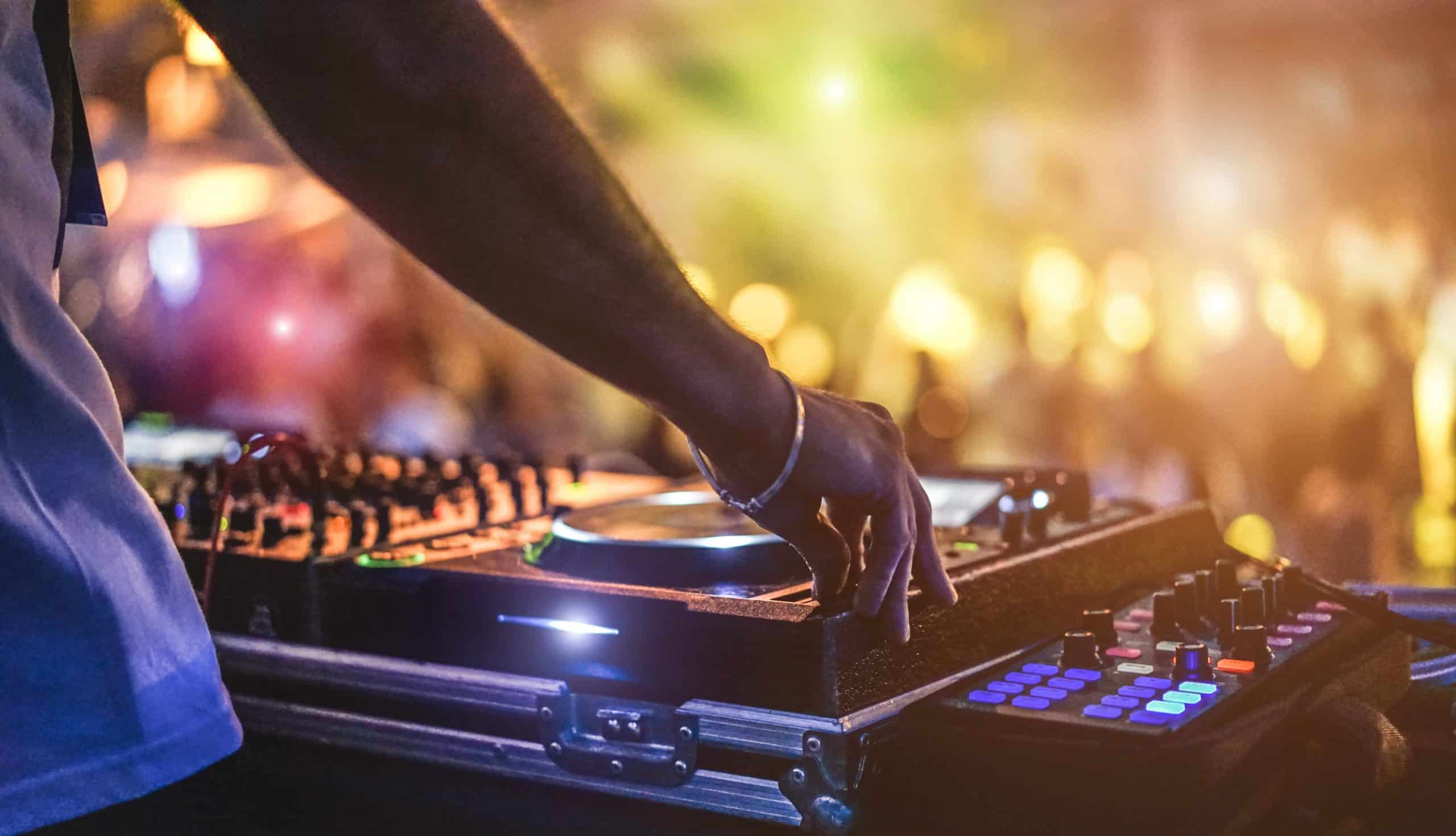 Ibiza's vibrant nightlife comes alive as a world-class DJ performs at an exclusive nightclub, making it the ultimate private jet destination for partygoers seeking unforgettable experiences